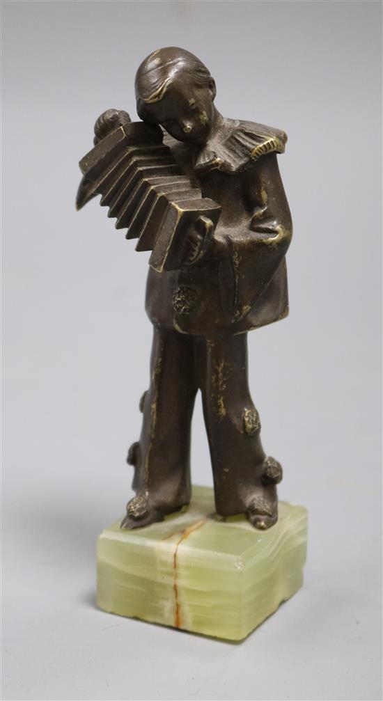 A bronze accordion player on onyx base